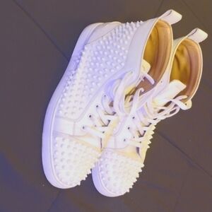 White on White mid-top Christian Louboutin spiked sneakers. Very lightly used